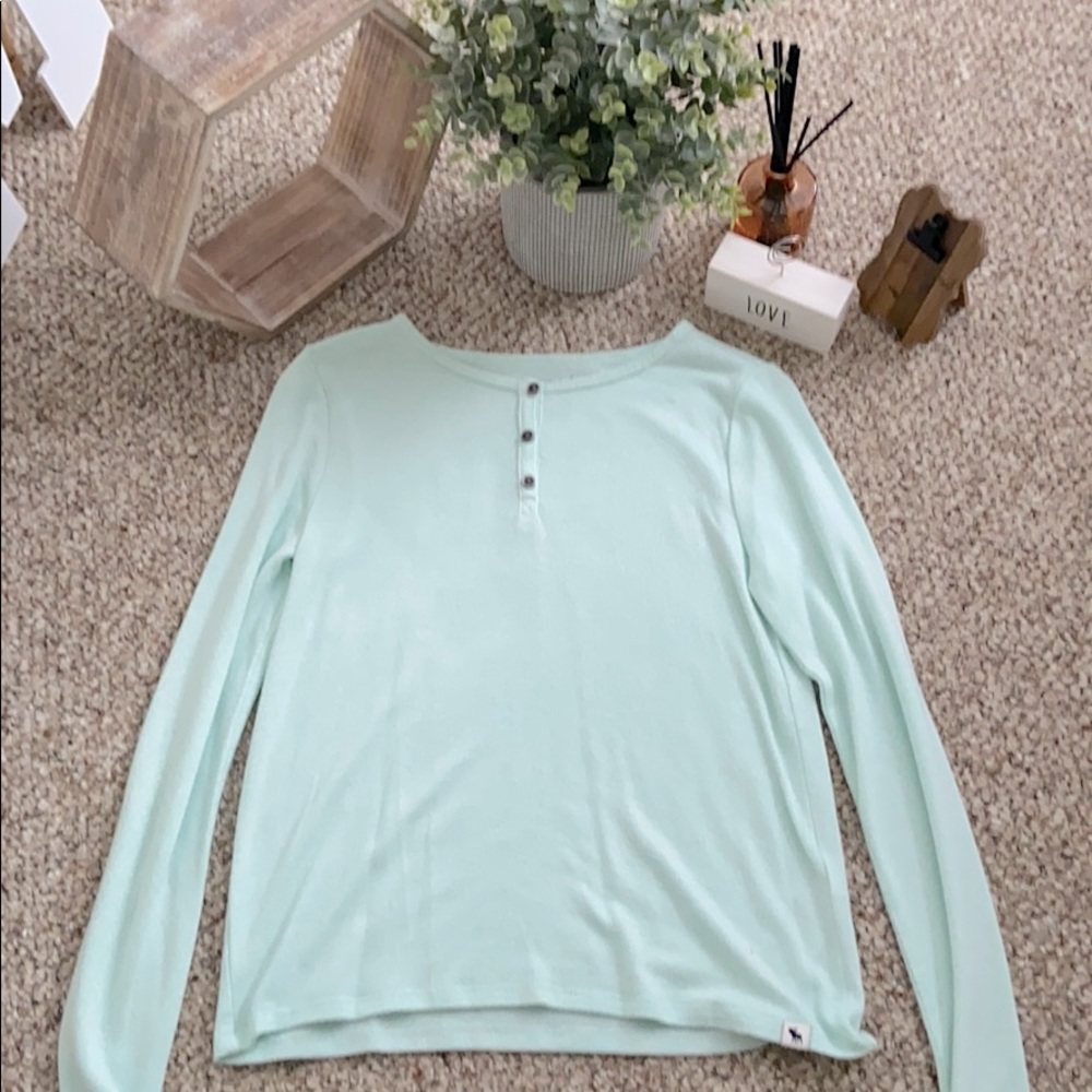 A light baby blue button up shirt
